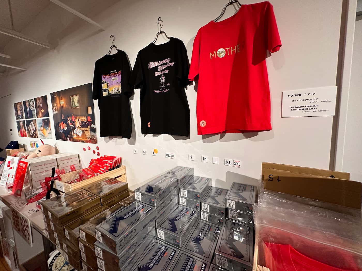 Various merchandise items displayed in the gift shop at the end of the Mother Museum exhibition.